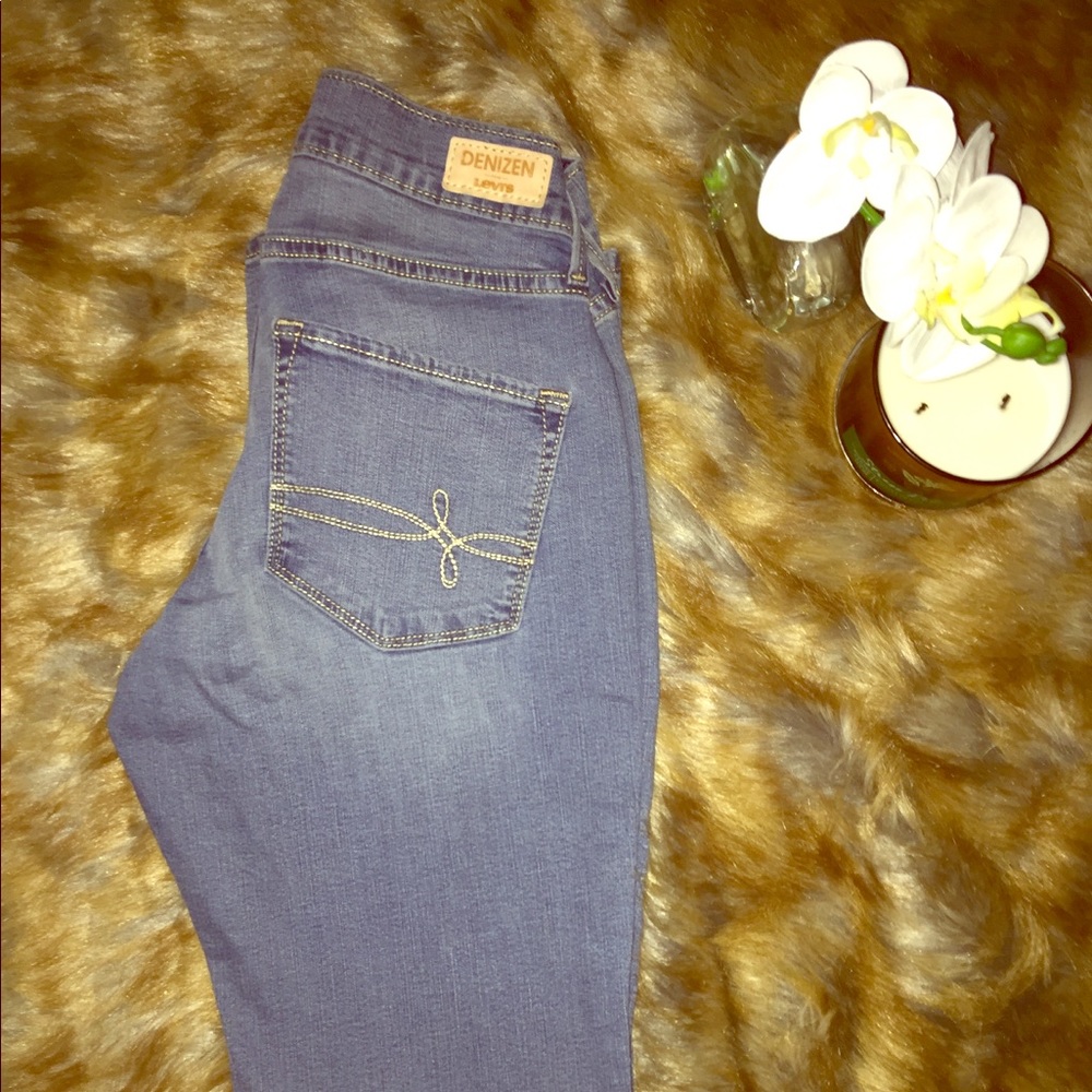 Medium wash denim Levi’s jeans.